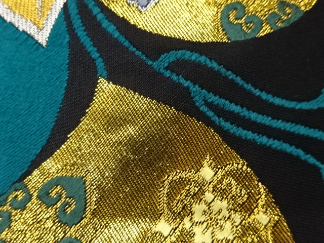  葉に華文模様織出し袋帯